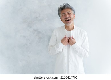 Fashionable Middle Aged Asian Man Dressing Up White Shirt