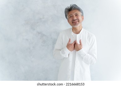 Fashionable Middle Aged Asian Man Dressing Up White Shirt