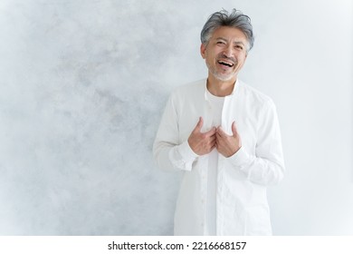 Fashionable Middle Aged Asian Man Dressing Up White Shirt