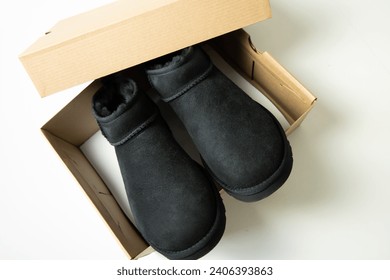 Fashionable modern short UGG boots made of sheep fur for the winter. 