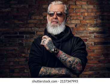 Fashionable Old Man With Sunglasses Dressed In Black Hoody