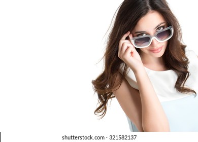 Fashionable portrait of a brunette in sunglasses, isolated on white background