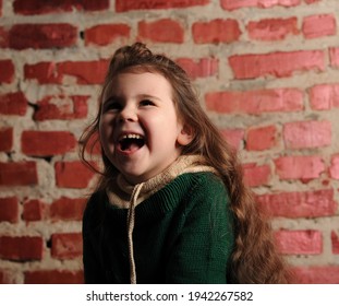 
Fashionable Portrait Of A Girl 5 Years Old In A Knitted Sweater On A Black Background