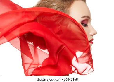 Fashionable Portrait Of A Girl Model With Waving Red Silk Scarf. Fashion, Glamour Accessories, Evening Makeup. Freedom Vamp Bright Style, Lady In Red On White Background