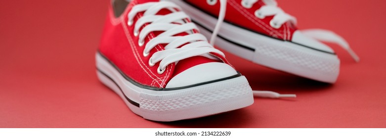 Fashionable Red Sports Sneakers With White Laces Closeup