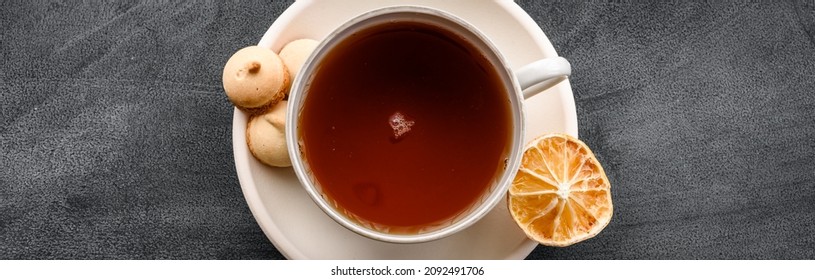 A Fashionable Stock Postcard With A View From Above - A Cup Of Tea On A Black Table.  Top View.