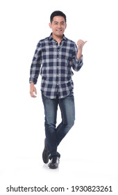 Fashionable And Stylish Man. Full Length Portrait Of Happy Handsome Young Man With Hand, Thumbs Up 
Posing In Studio


