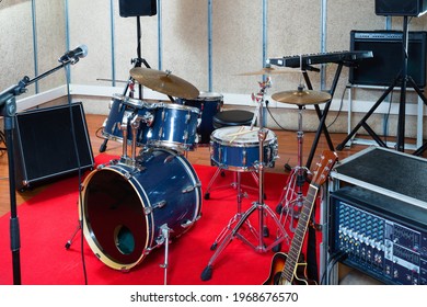 Fashionable Stylish Music Instruments And Equipments For Rock Band In Empty Rehearsal Room