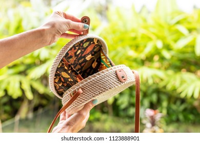 Fashionable stylish rattan bag in the tropical garden. Tropical island of Bali, Indonesia. Rattan handbag. - Shutterstock ID 1123888901