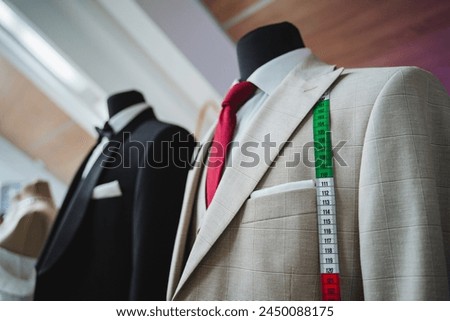 A fashionable suit complete with a dress shirt, tie, blazer, collar, and sleeves. Perfect for a formal event or uniform for whitecollar workers. Includes a measuring tape as a fashion accessory
