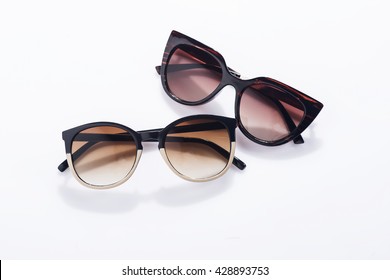Fashionable sunglasses on white background