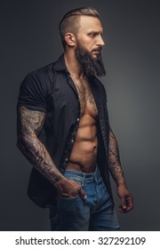 Fashionable Tatooed Man With Beard In Casual Clothing.