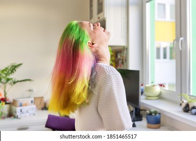 Fashionable Teen Girl With Trendy Rainbow Dyed Long Hair Combing Her Hair At Home. Hair, Hairstyles, Coloring Fashion, Youth And Beauty