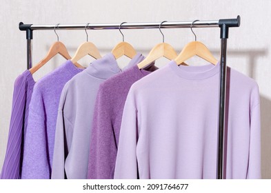 Fashionable Tops In Trendy Purple, Very Peri, Lavender Colors Hanging On A Shopping Rail. Styling, Circular Economy.