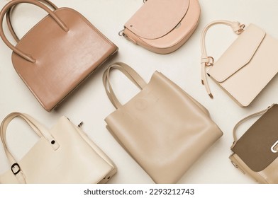 Fashionable woman bag on color background, top view