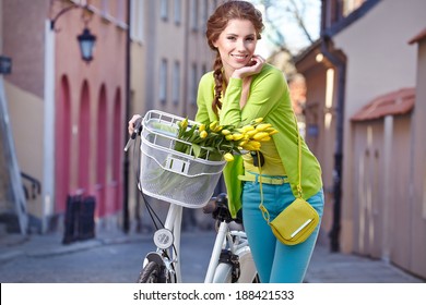 Fashionable Woman With A Bicycle On The Streets Of Old Paris