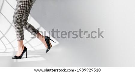 Fashionable woman in black shiny heels social banner