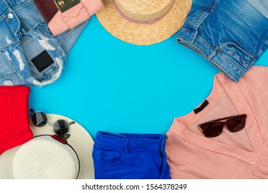 Fashionable Woman Clothes Flatlay On Blue Background