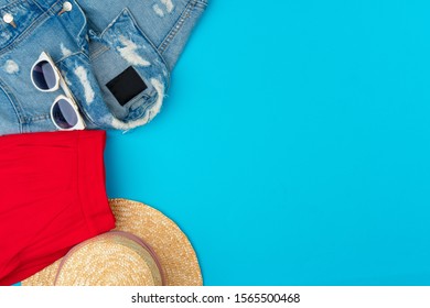 Fashionable Woman Clothes Flatlay On Blue Background