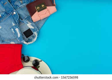 Fashionable Woman Clothes Flatlay On Blue Background