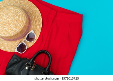 Fashionable Woman Clothes Flatlay On Blue Background