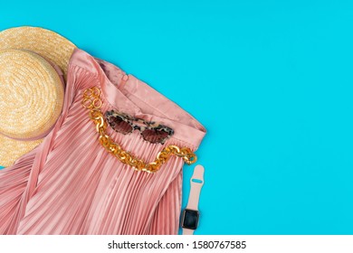 Fashionable Woman Clothes Flatlay On Blue Background