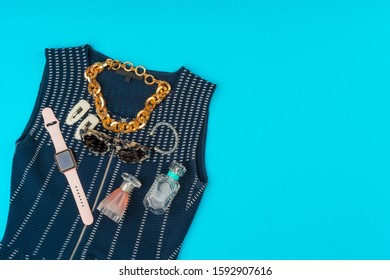 Fashionable Woman Clothes Flatlay On Blue Background