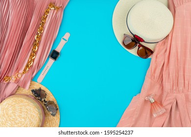 Fashionable Woman Clothes Flatlay On Blue Background