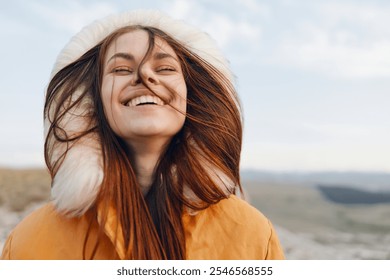 Fashionable woman smiling in orange fur hooded coat, beauty and style in winter fashion trends - Powered by Shutterstock