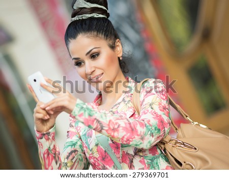 Fashionable woman talking cell phone bussiness woman smiling girl with smartphone, female on city street with mobile phone doing selfie, series