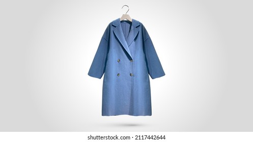 Fashionable Women Faux Shearling Coat On A Hanger Isolated On Green Background.  Composition Of Clothes. Flat Lay, Top View, Copy Space. Winter Clothes Pattern. Ladies' Trench Coat. Pattern