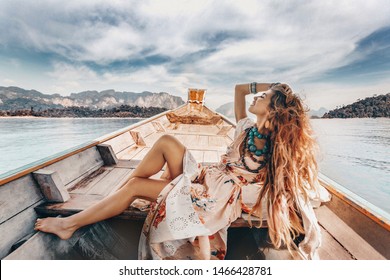 Fashionable Young Model In Boho Style Dress On Boat At The Lake 