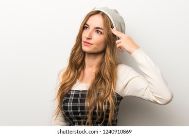 Fashionably woman wearing hat with problems making suicide gesture