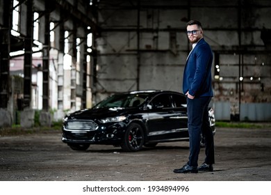 Fasion Photoshooting Of A Man In Elegant Formal Clothes. Young Succesfull Rich Guy On Black Car Background. Closeup.