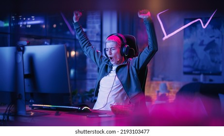 Fasionable Female Gamer Winning in Online Video Game on Computer. Portrait of Young Stylish Woman in Headphones Playing PvP Tournament with Other Players, Talking with Team on Microphone. - Shutterstock ID 2193103477