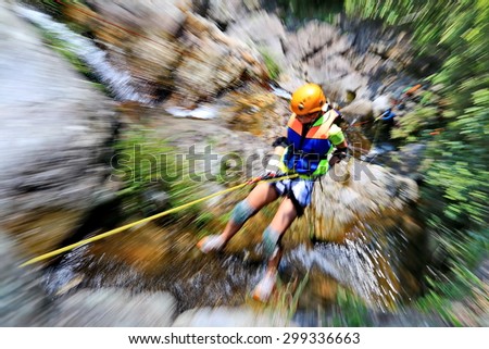Fast abseiling down to the valley