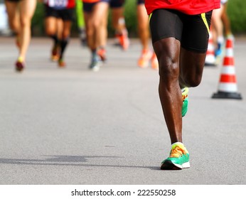 fast athlete runs down the street during the race outdoors - Shutterstock ID 222550258