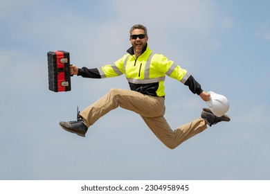 Fast building. Funny construction worker jumping. Excited jump of builders in helmet. Worker in hardhat. Construction engineer in builder uniform jump. Excited foreman jump. Speed build.