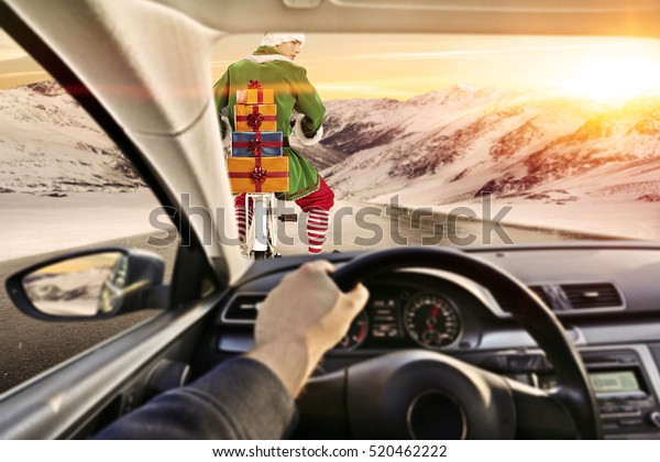 Fast\
car with driver in interior of car and elf on road\
