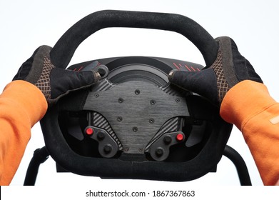 Fast car driver theme. Sport car steering wheel in hands close up view