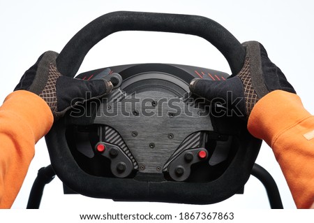 Fast car driver theme. Sport car steering wheel in hands close up view