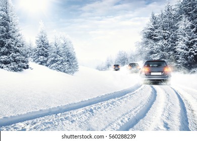 fast car on winter road and snow splash 