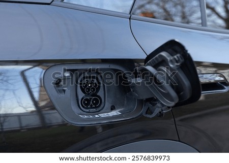 Fast charging socket type 2 combo electric car. Type 2 CCS plug port on electric vehicle. DC - CCS type 2 EV charging connector at EV car. Eco friendly alternative energy green environment concept
