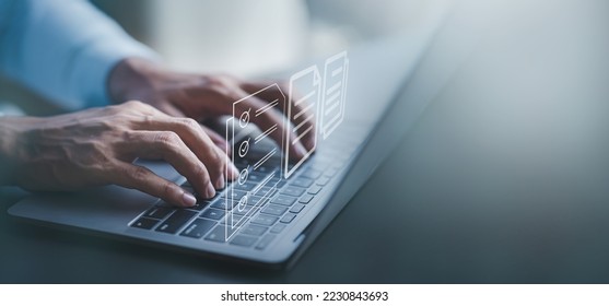 Fast checklist and clipboard task management.Business working on laptop computer productivity checklist and filling survey form online Document management concept . - Shutterstock ID 2230843693