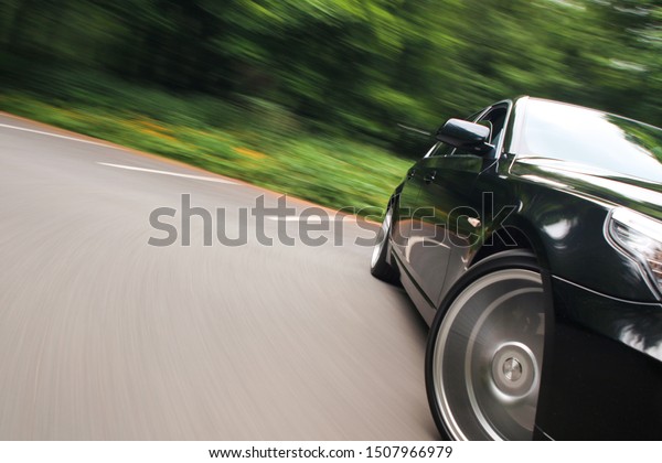 Fast driving car with\
blurred motion 