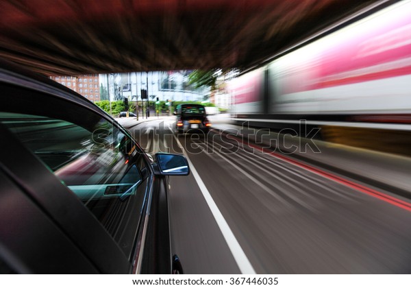 Fast driving car in\
tunnel.