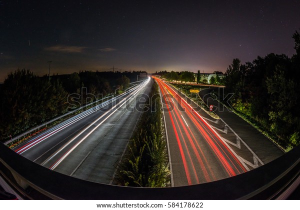 Fast driving cars\
highway with long exposure
