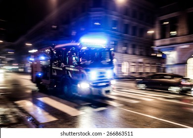 Fast Driving Fire Truck In A Night City