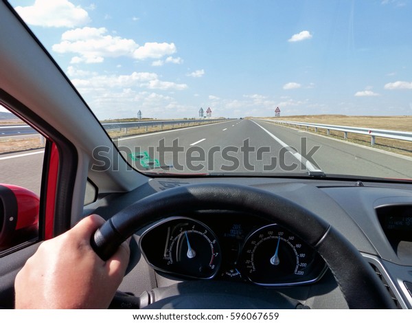 Fast driving\
on a straight highway on a sunny\
day