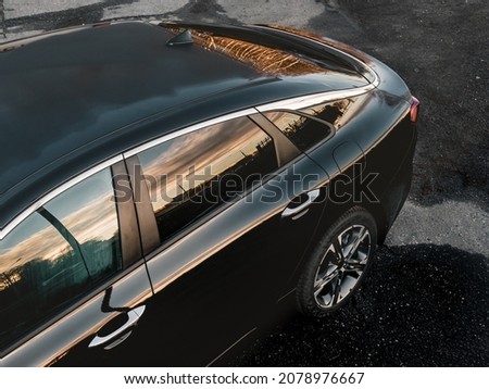 Fast driving sports car with blurred background in city